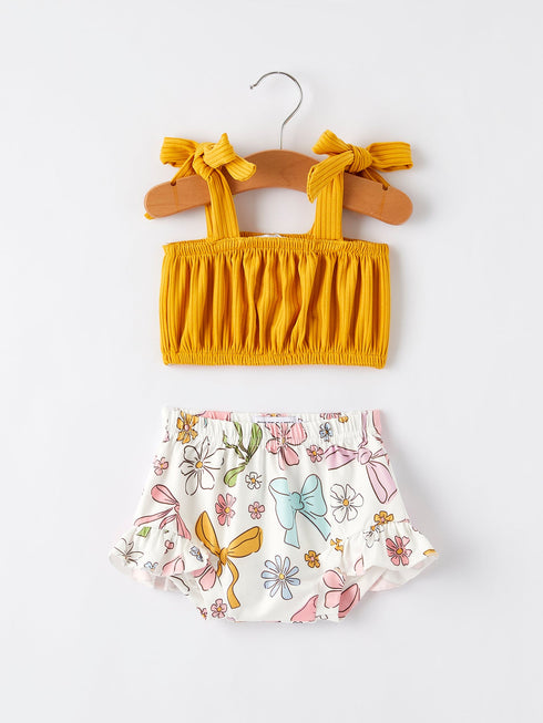 spring-summer-yellow-bow-suspender-vest-and-floral-bloomers-set Rylee Faith Designs - Sophia's StyleOutfit-1