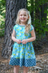 vintage-teal-garden-picnic-dress-w-hairbow Little Miss Marmalade-Sophia's Style-https://cdn.shopify.com/s/files/1/0303/8344/0012/files/3.jpg?v=1758370838