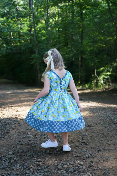 vintage-teal-garden-picnic-dress-w-hairbow Little Miss Marmalade-Sophia's Style-https://cdn.shopify.com/s/files/1/0303/8344/0012/files/4_627d44bf-a19b-4f76-9723-c3c966b5966a.jpg?v=1758370834