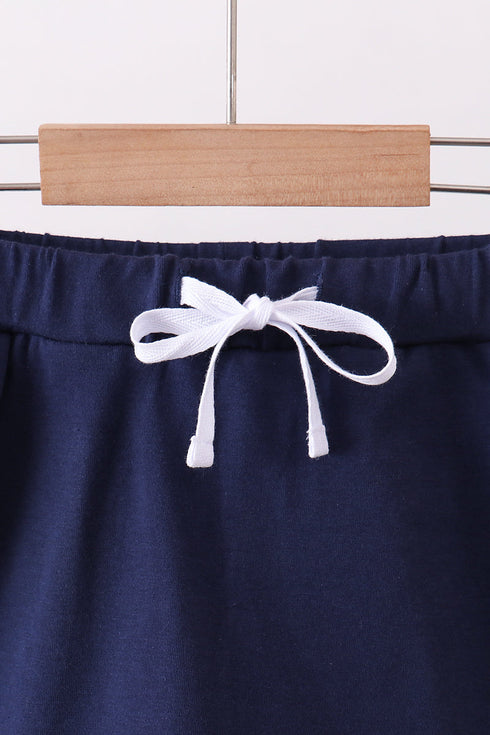 Navy scallop hem bow skort