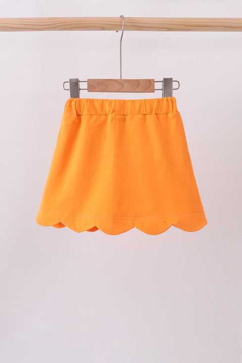 Orange scallop hem bow skort