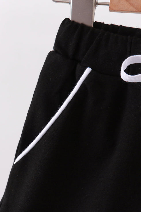 Black scallop hem bow skort