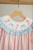 Pink candy cane bow hand smocked ruffle romper