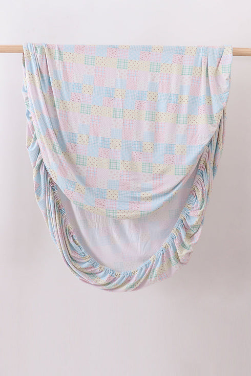 Pink floral checkered bamboo crib sheet