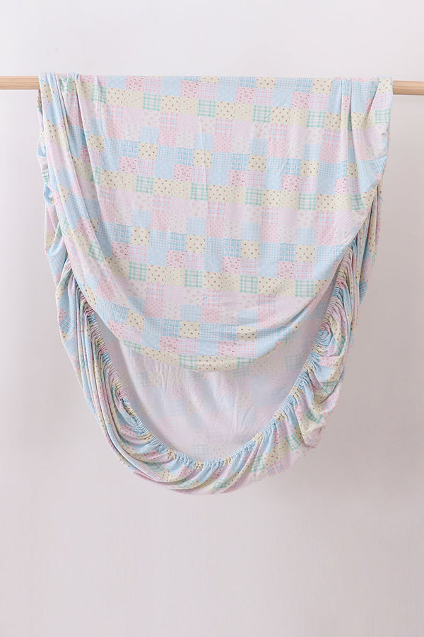 Pink floral checkered bamboo crib sheet
