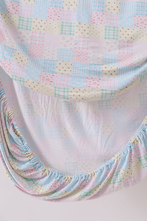 Pink floral checkered bamboo crib sheet