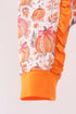 orange-pumpkin-print-ruffle-romper-sophias-style-2