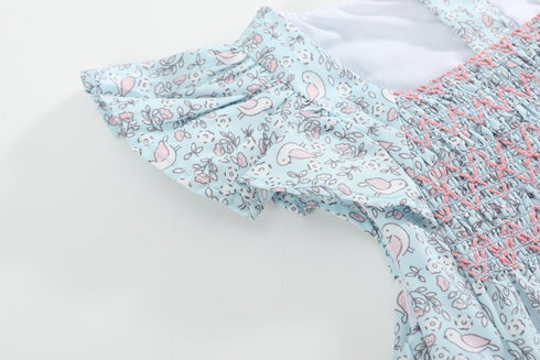 floral-blue-dove-smocked-flutter-bubble-romper-lil-cactus-sophias-style-5