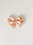 peach-gingham-pinwheel Boosh Baby - Sophia's Style-1
