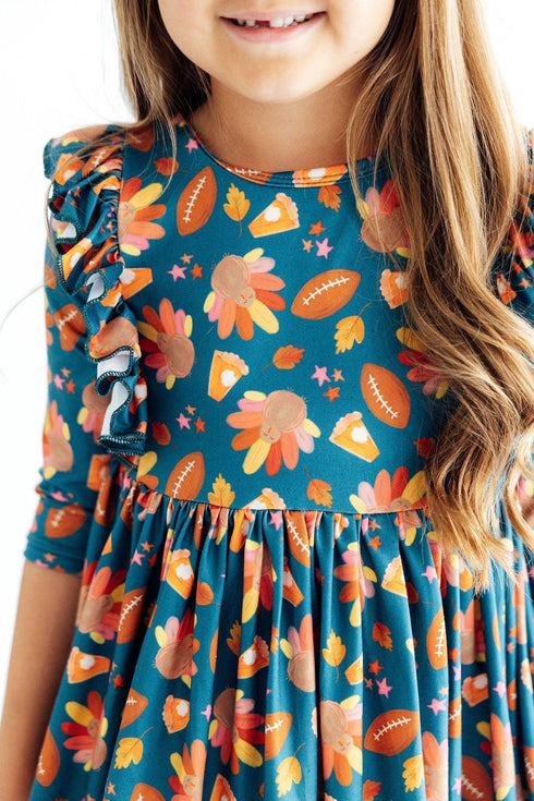 gobble-til-you-wobble-3-4-sleeve-ruffle-twirl-dress-sophias-styleTwirl Ruffle Dress 3/4-1