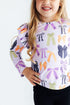 tied-with-a-boo-lavender-l-s-ruffle-tee-sophias-style-2